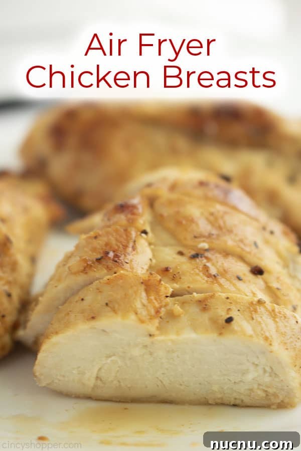 Juicy Air Fryer Chicken Breasts: Quick Crispy Recipe in 20 Minutes 5 Text on image Air Fryer Chicken Breast on a white cutting board sliced