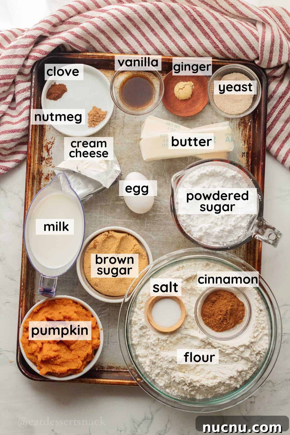 Pumpkin Spice Cinnamon Rolls: Soft, Fluffy Fall Recipe 3 Ingredients for pumpkin cinnamon rolls labeled in glass bowls on metal baking sheet.