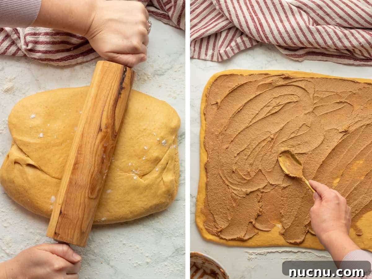 Pumpkin Spice Cinnamon Rolls: Soft, Fluffy Fall Recipe 7 Rolling pin on pumpkin dough and spreading pumpkin filling on pumpkin dough.