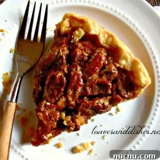 Old Fashion Pecan Pie on a plate with a fork