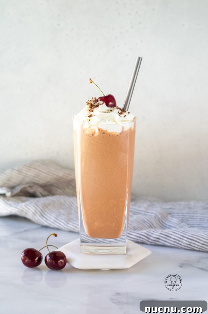 Decadent Chocolate Peanut Butter Milkshake Recipe 2 Chocolate Peanut butter Milkshake on a white coaster