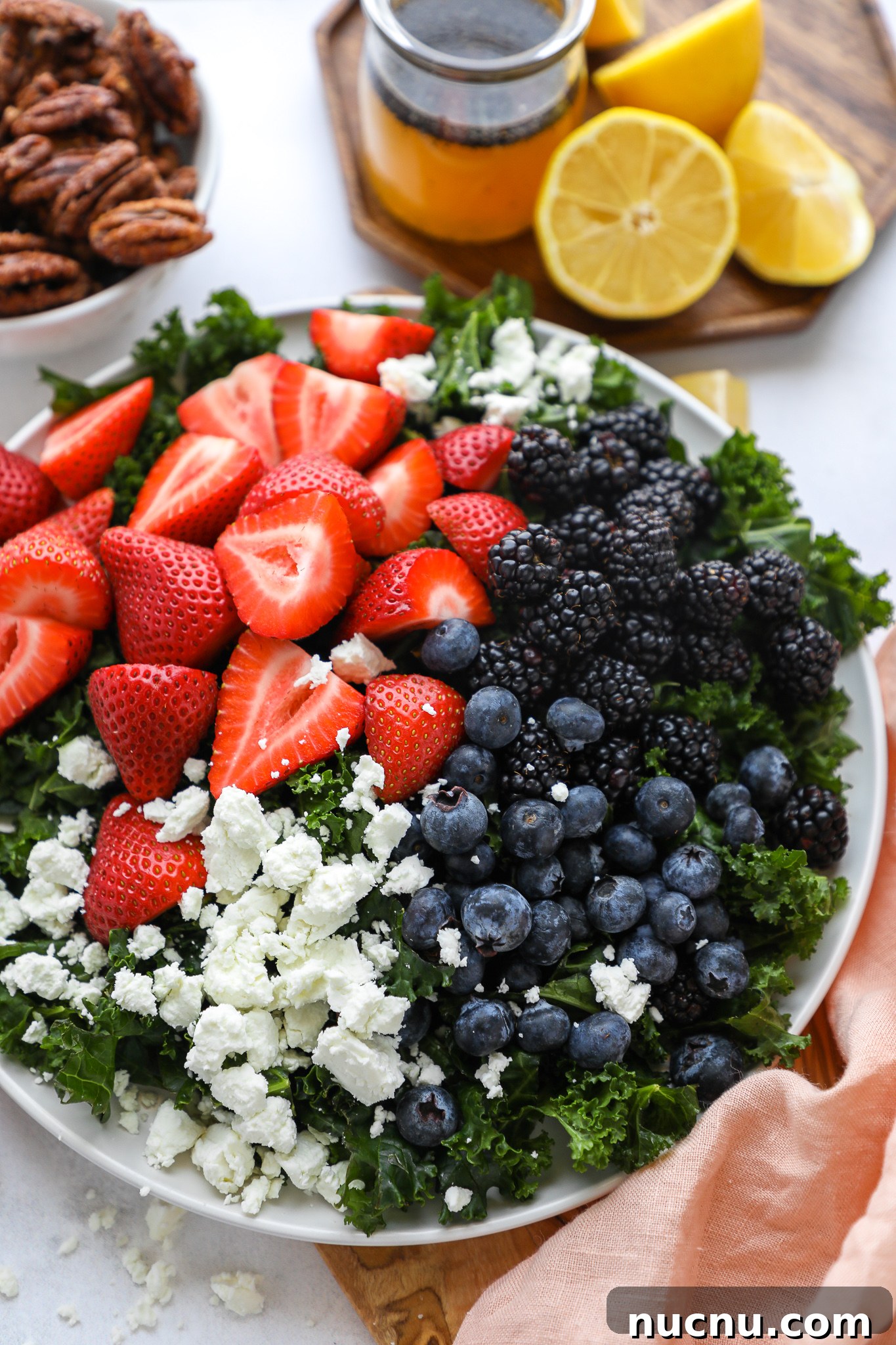 Mixed Berry and Kale Salad with Lemon Poppy Seed Dressing 3 A simple spring and summer salad made with fresh seasonal fruit, goat cheese and the best homemade candied pecans!