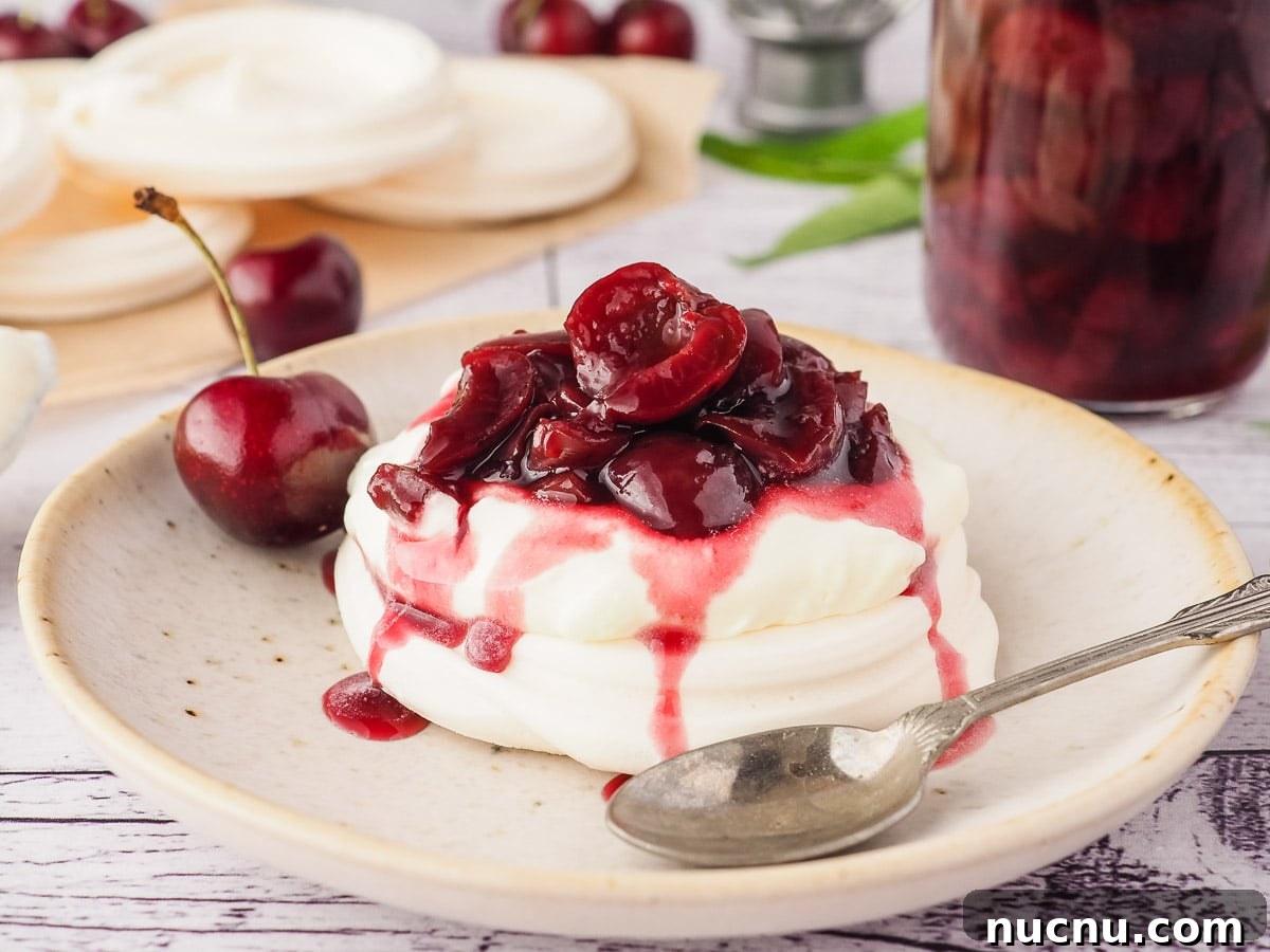 Homemade Cherry Compote Recipe for Desserts and Breakfast 6 Cherry compote drizzled over meringue nests with cream.