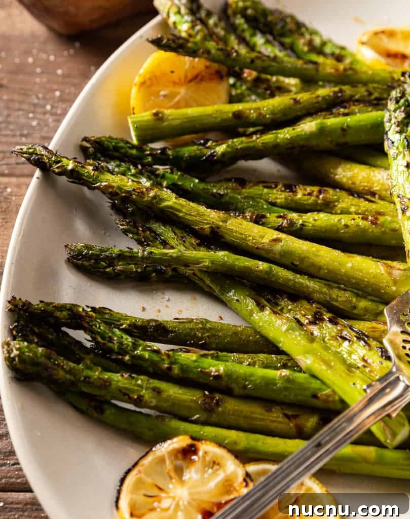 Perfectly Grilled Asparagus: Tender Charred Spears in 15 Minutes 5 grilled asparagus with lemon