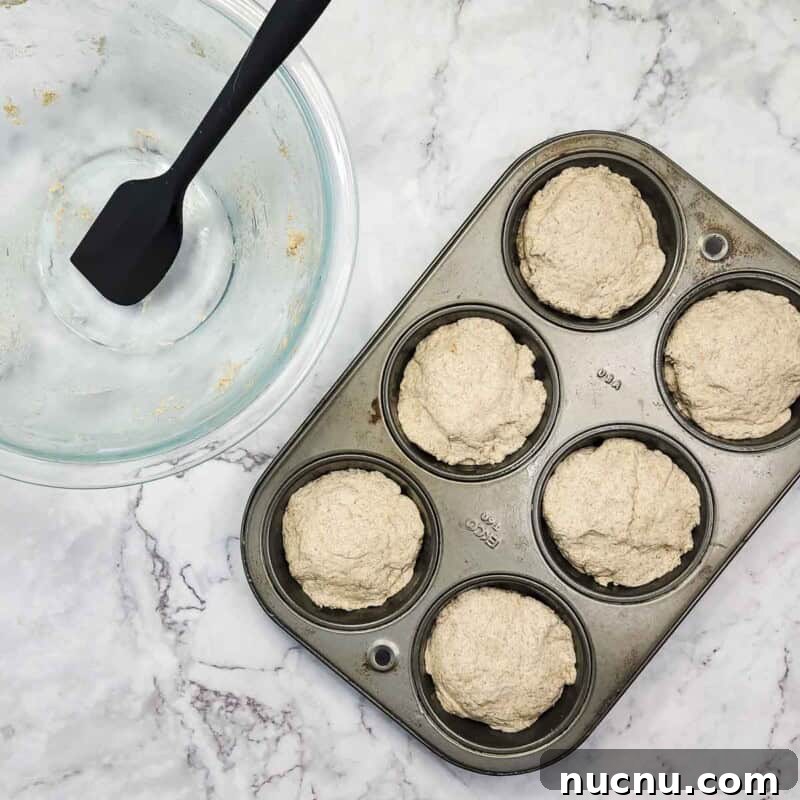 Cover cheese with remaining dough and smooth the tops.