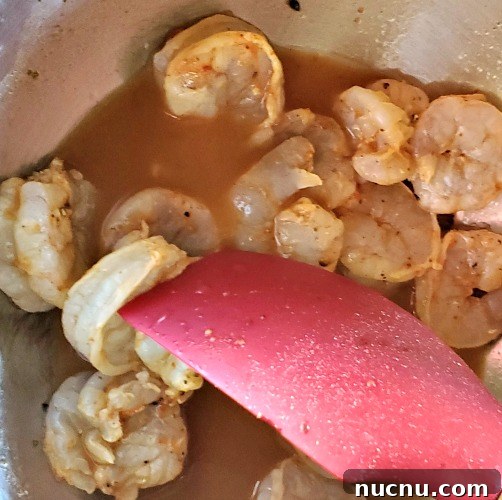Blackstone Griddle Shrimp Fajitas Recipe — Juicy Sizzling Skillet Meal 3 Shrimp for fajitas in marinating in marniade